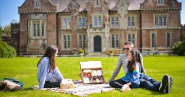 Family enjoying a picnic at Well's House Gardens